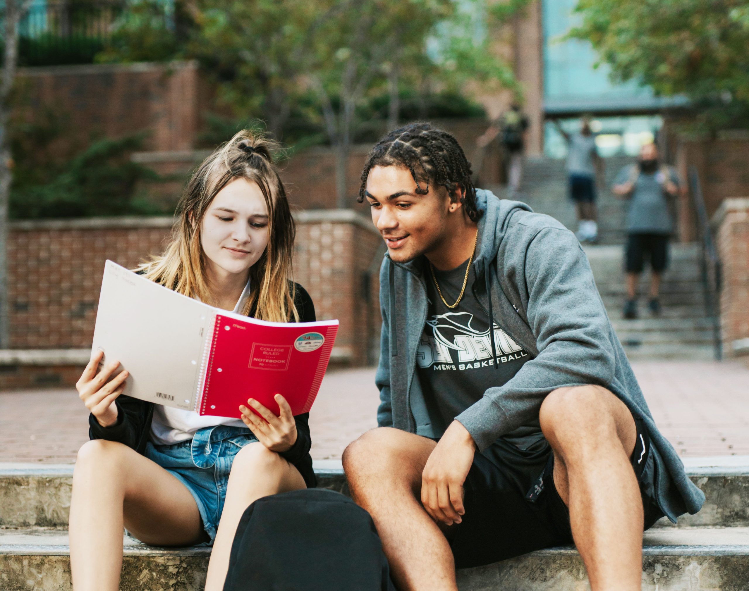 CFCC students looking at a notebook